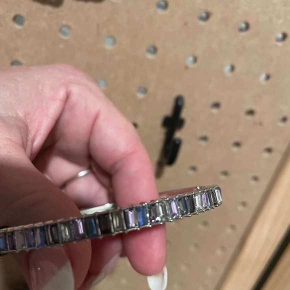 Slim silver hinge bangle with multiple baguettes in blues and silvers. - Picture 3 of 4